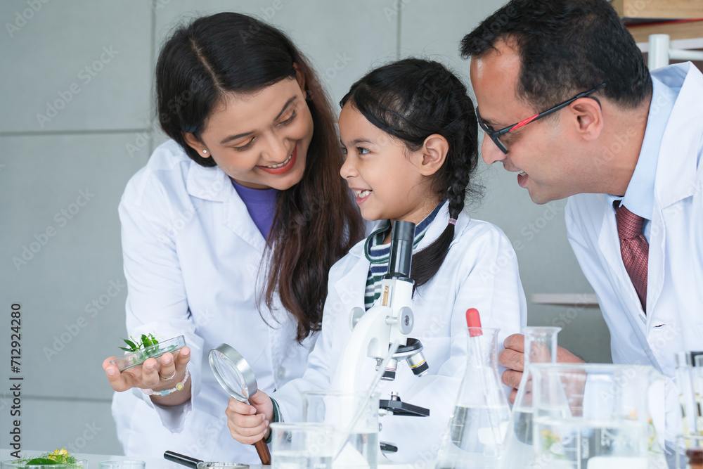 Asian Scientist Kid Student And Indian Teacher Have Fun With Plant At