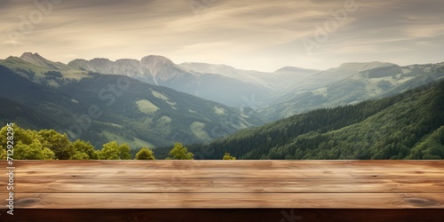 Mountainous area with a focused wooden table. photo