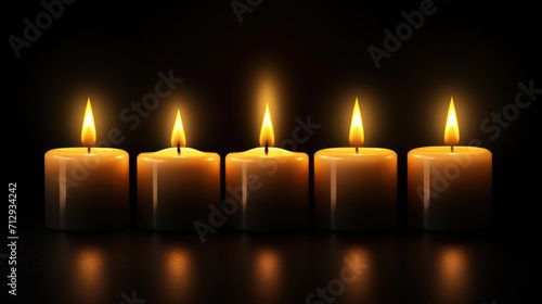Row of Lit Candles in Dark
