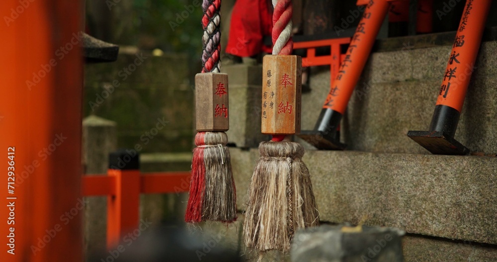 Location, torii gates and temple for religion, travel or traditional landmark closeup for spirituality. Buddhism, Japanese culture and trip to Kyoto, zen or prayer on pathway by Fushimi Inari Shinto