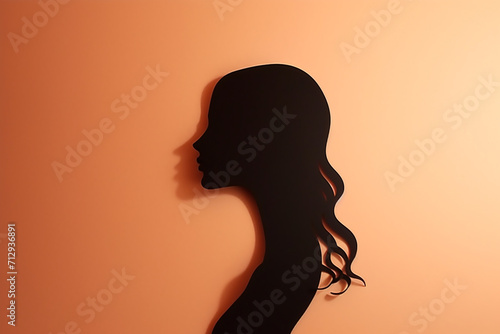 Beauty, fashion, style, make-up and hairstyle concept. Paper cut of woman silhouette portrait on plain background with copy space. Simple logo design