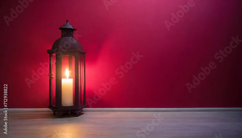 Discover the allure of a softly lit candle on a table, positioned in front of a captivating red wall, leaving room for text or presentations.