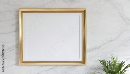 Gold frame on white marble wall background with plants © Lied