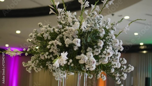 Elegant flower decoration with Gypsophila paniculatas and white roses. Wedding details. photo