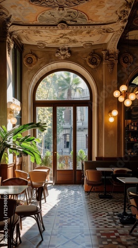 A room with tables  chairs  and a potted plant