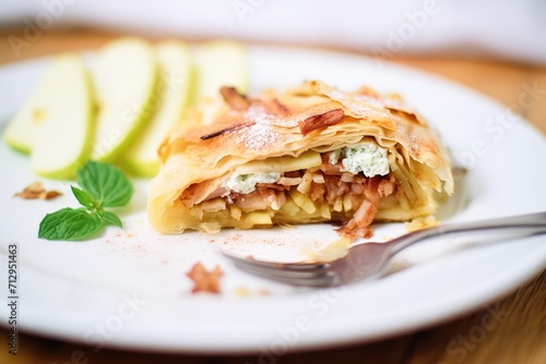 sliced apple strudel with oozy apple filling close-up