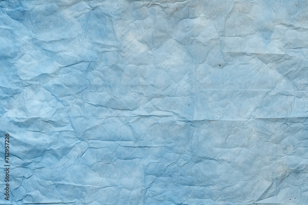 Fototapeta premium Blue recycled paper crumpled texture background.
