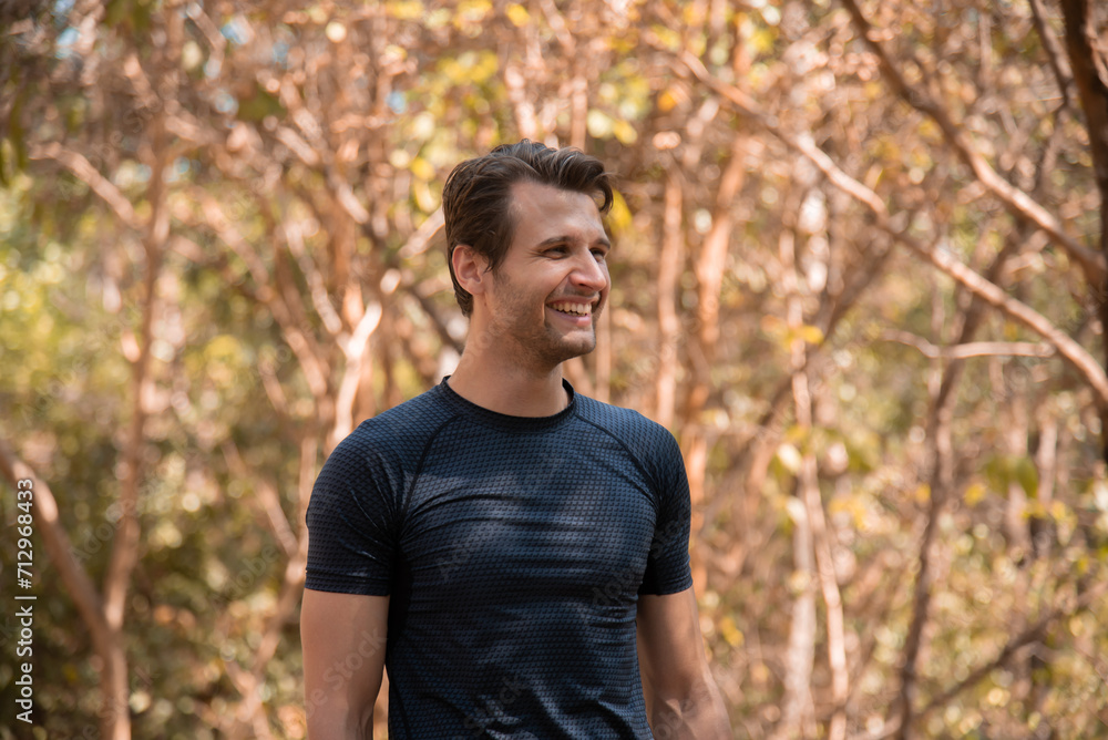 Portrait of happy caucasian handsome man confident and outdoors fitness. Muscular afro guy resting for a break after running outdoor. Fitness man taking a break after running workout. Portrait of happy caucasian handsome man confident and outdoors fitness. Muscular afro guy resting for a break after running outdoor. Fitness man taking a break after running workout.