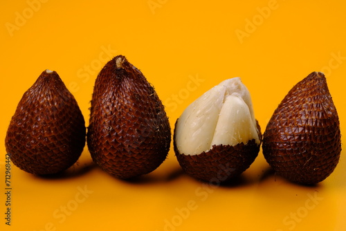 Salak is a type of palm fruit commonly eaten. It is also known as sala. In English it is called salak or snake fruit. Salacca zalacca. This fruit is called a snake fruit. Salak pondoh from Yogyakarta. photo