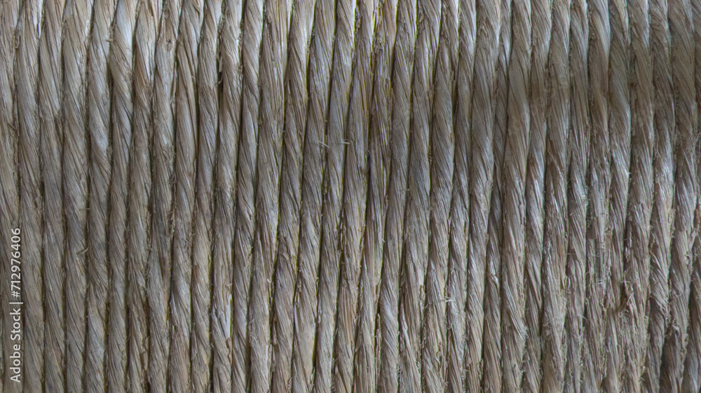 background beige of natural straw rope on spool make parallel threads of string texture background beige of natural straw rope on spool make parallel threads of string texture