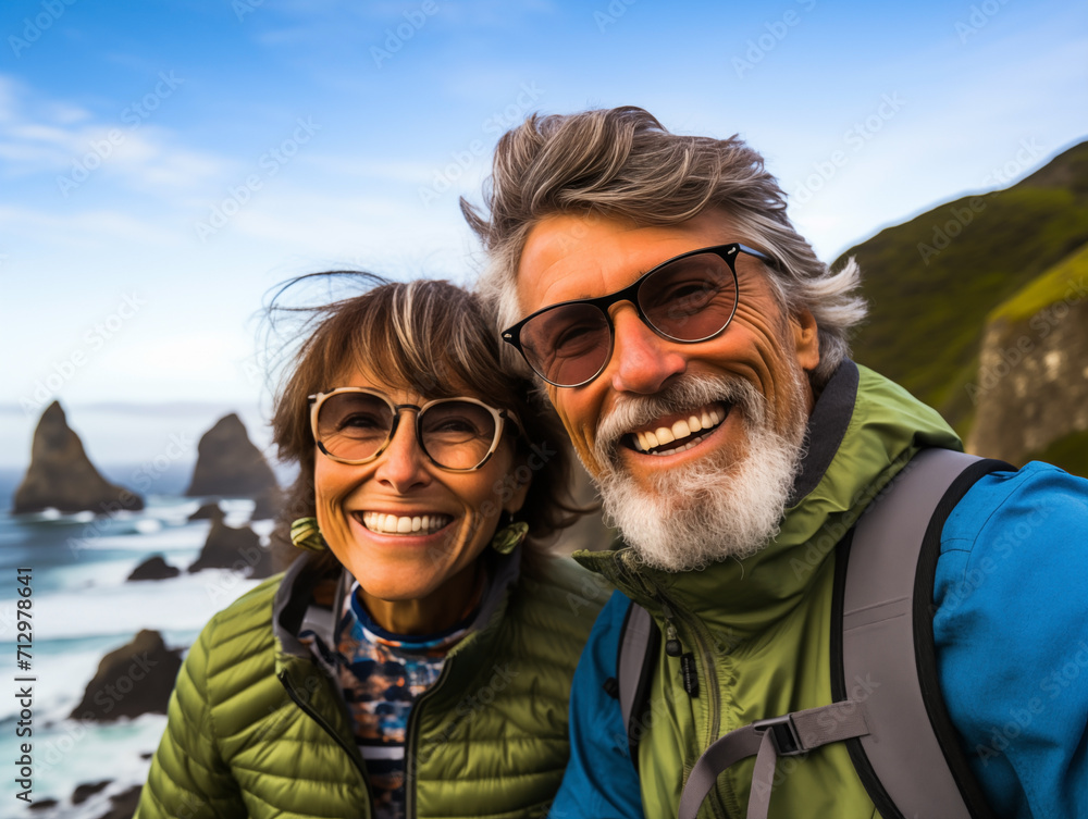 Senior couple closeup admiring the scenic on ocean. The concept of active life Senior couple closeup admiring the scenic on ocean. The concept of active life