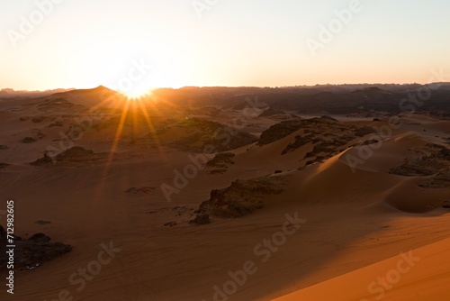 View of sunset the Dunes of Tin Merzouga in Tadrart Rouge, Tassili N'Ajjer National Park. Sahara, Algeria, Africa.