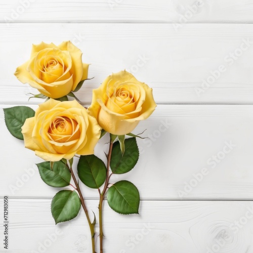 Three Yellow rose flowers over white wood background. Romantic greeting card for Valentine s Day.