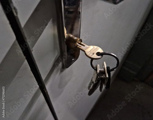 forgetting the keys in the lock and having your apartment or office burgled is a crime that affects not only children, but also forgetful adults and seniors. locksmith advertising, brain, dementia photo