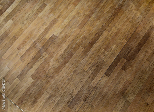 office wooden floor made of tropical wood that ages gradually turns gray. pressure impregnated, from short angled pieces stacked together like parquet. follows pavement in an arch, geometric, formal © Michal