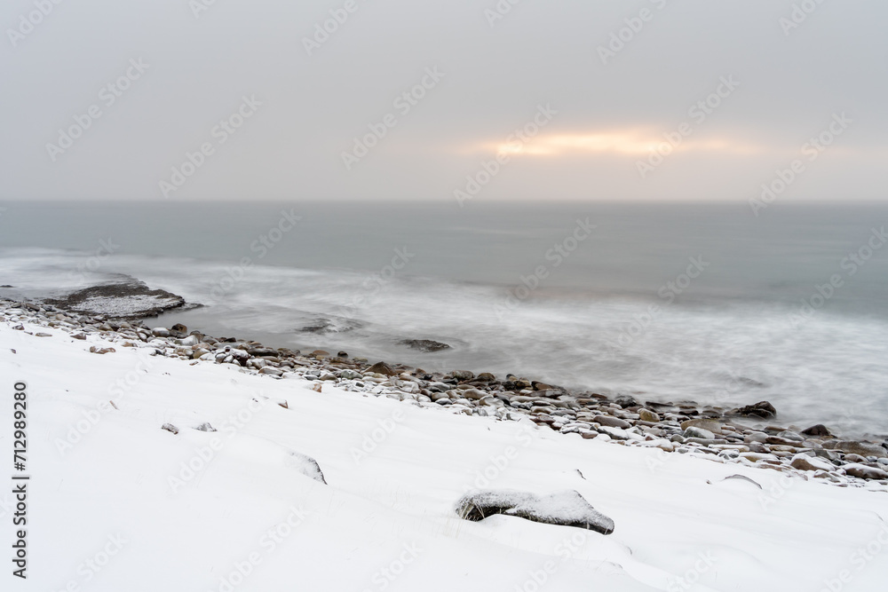 Wintry landscape by the sea in Ekkerøya during the polar night, Norway