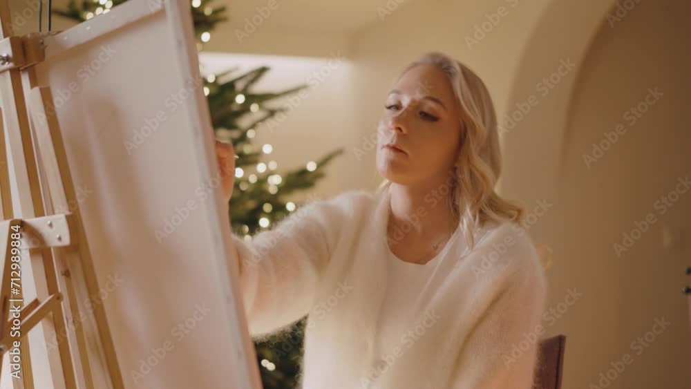 Beautiful Female Artist Painting Picture on Canvas and Mixing Colors in Cozy Room Beautiful Female Artist Painting Picture on Canvas and Mixing Colors in Cozy Room