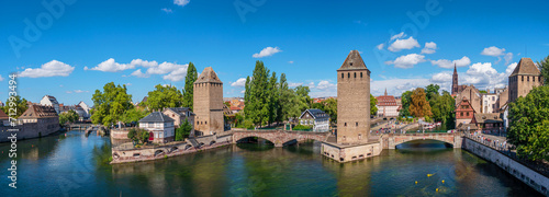 Panoramic view on The Ponts Couverts in Strasbourg with blue cloudy sky. France.