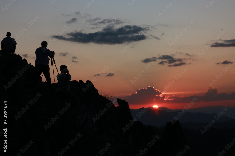 silhouette of phoographers at sunset