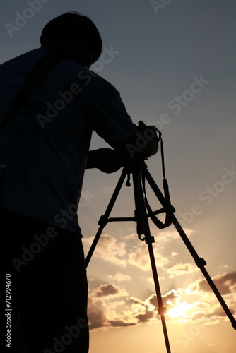 photographer at sunset