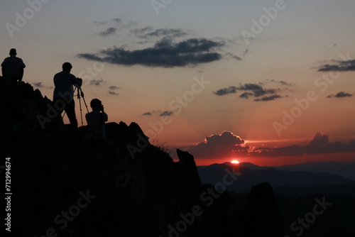 silhouette of phoographers at sunset