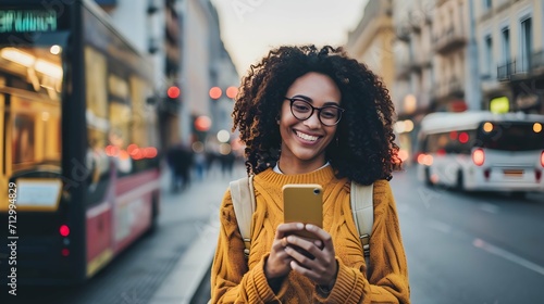 Happy Woman Using Mobile Phone App on City Street