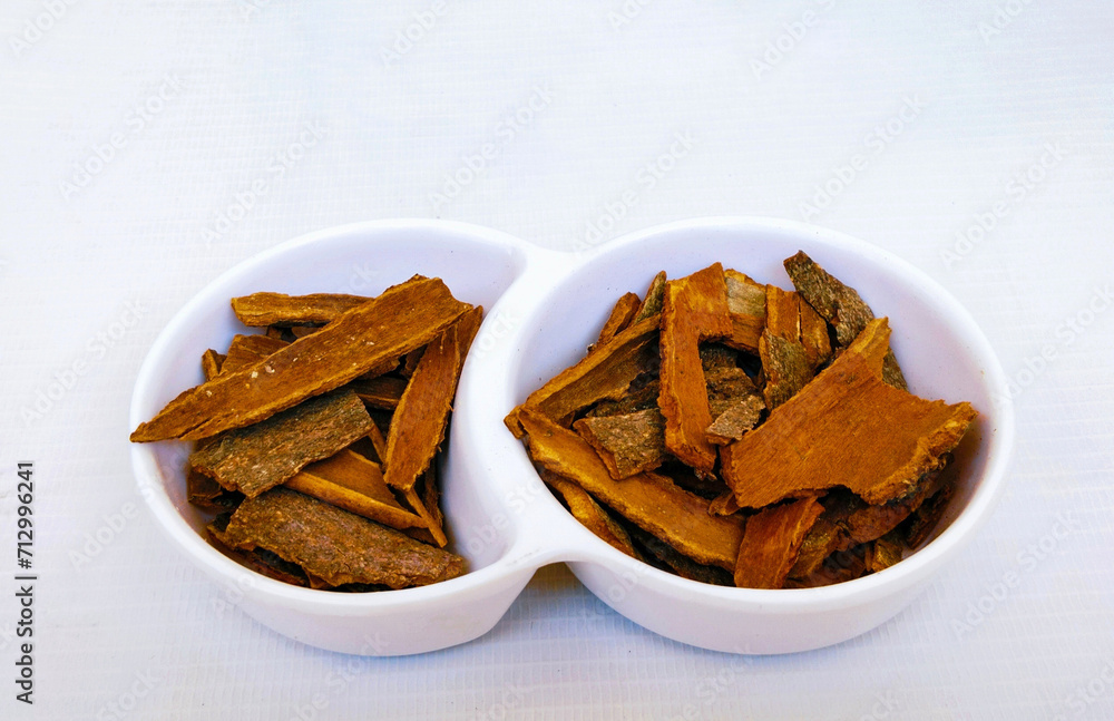 Cinnamon brown sticks spice dalchini darchini dried inner bark strips flavoring food ingredient closeup view image picture on white background stock photo