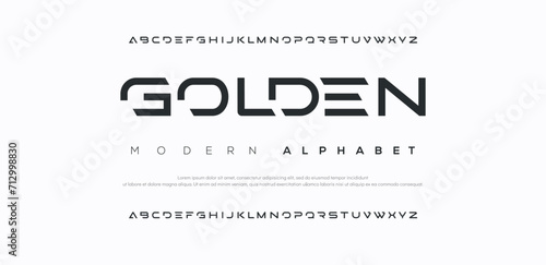Golden Creative modern alphabet. Dropped stunning font, type for futuristic logo, headline, creative lettering and maxi typography. Minimal style letters with yellow spot. Vector typographic design	 photo