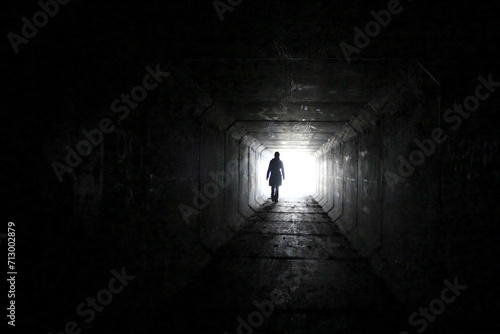 silhouette of a person in the tunnel