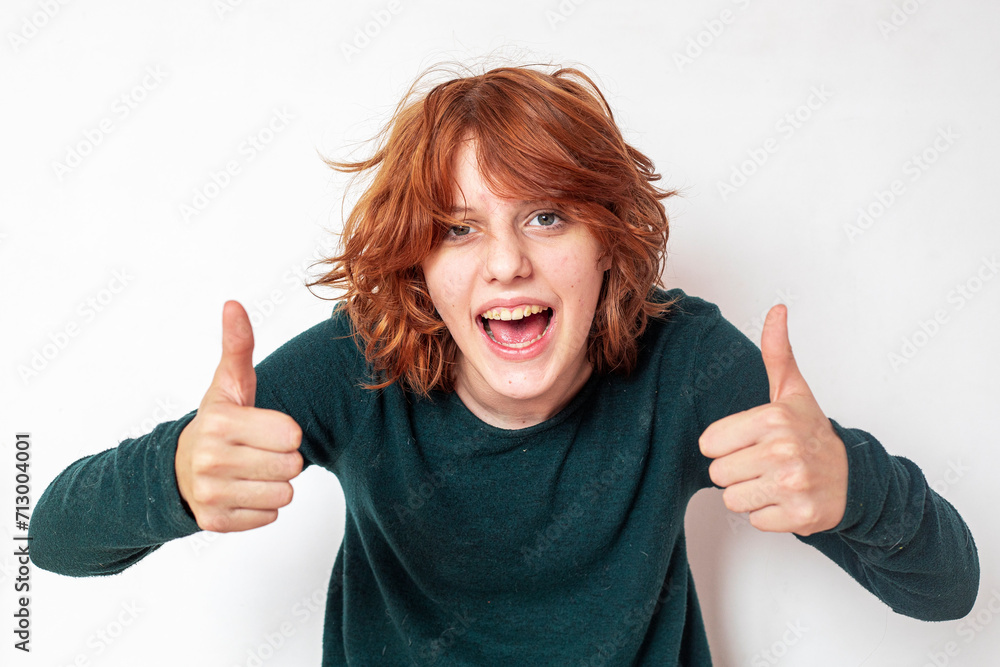 portrait of a pensive teenage girl with red hair with a stylish anime hairstyle portrait of a pensive teenage girl with red hair with a stylish anime hairstyle