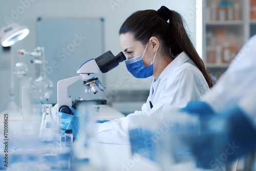 Photos Confident scientist working in the science lab