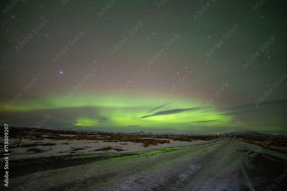 Northern lights in Gullfoss area in winter with ice in Iceland