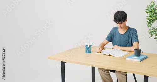 Young student doing his homework