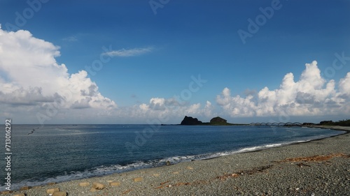 Lonely Beach with Driftwood and Sanxiantai View in Taitung photo
