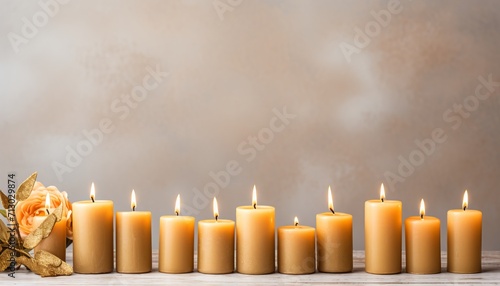 Elegant handmade wax candles on serene minimalist background with ample free space