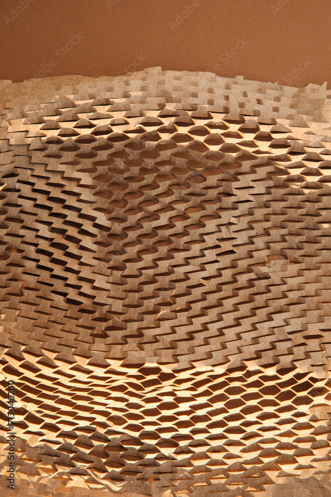Packaging of eco-materials. Packaging paper on a brown background. Concept saving the planet from undetectable debris. Top view Packaging of eco-materials. Packaging paper on a brown background. Concept saving the planet from undetectable debris. Top view