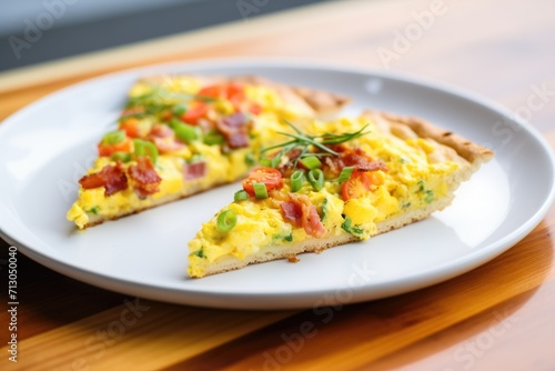breakfast pizza slice with scrambled eggs, bacon bits, and cheese
