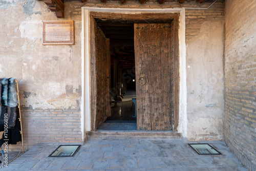 entrance door of Juma Mosque and its wooden columns, in Khiva, Uzbekistan. © diy13