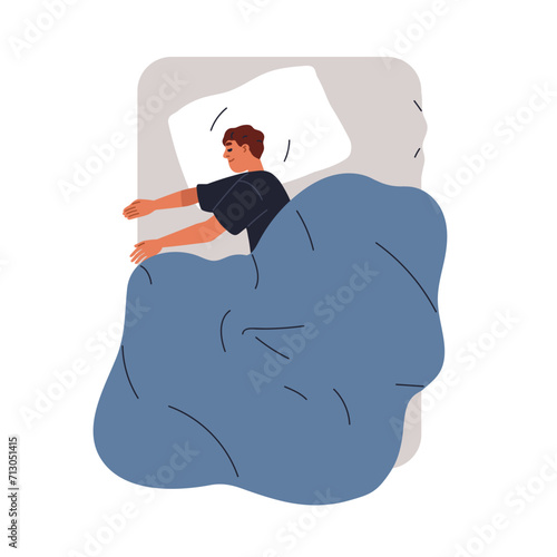 Happy man sleeping in bed. Sleeper lying in side position under blanket. Youn...