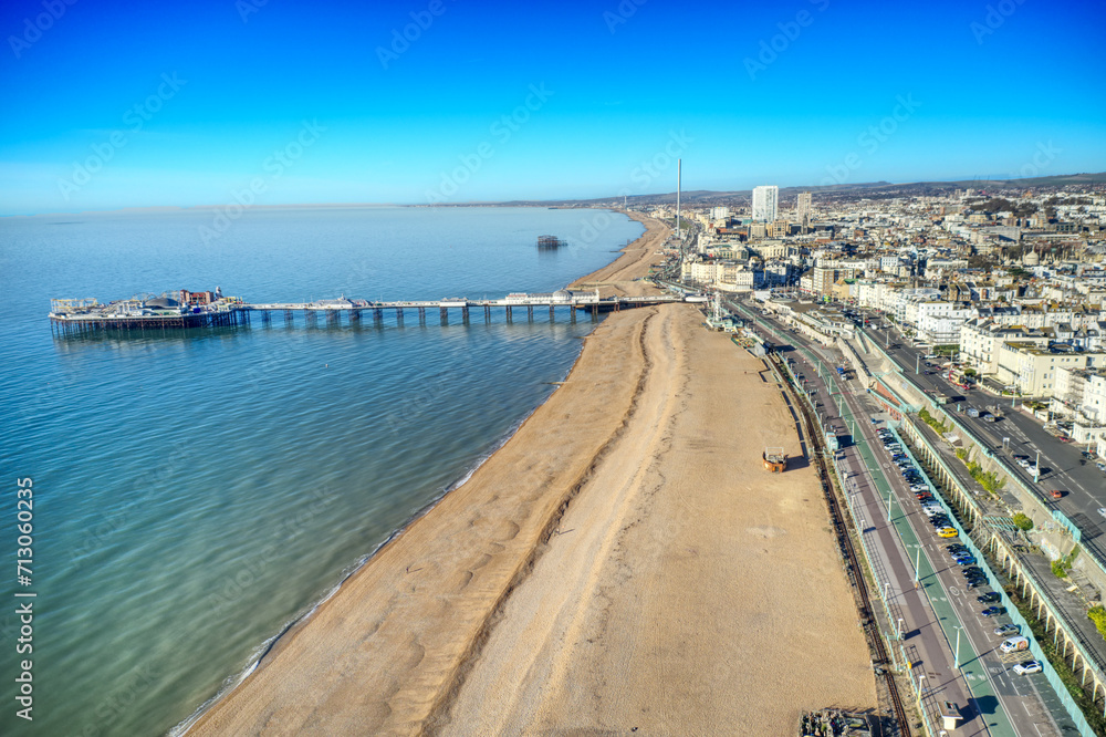 Aerial view along Brighton Beach towards the Victorian Palace Pier, a popular seaside resort in East Sussex England. Aerial view along Brighton Beach towards the Victorian Palace Pier, a popular seaside resort in East Sussex England.