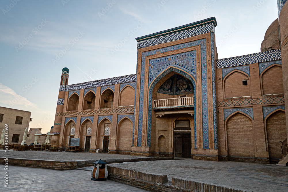 Islam Khoja Madrasah in ancient city of Khiva in Khorezm, facing the mausoleum with mosaics and glazed ceramic tiles