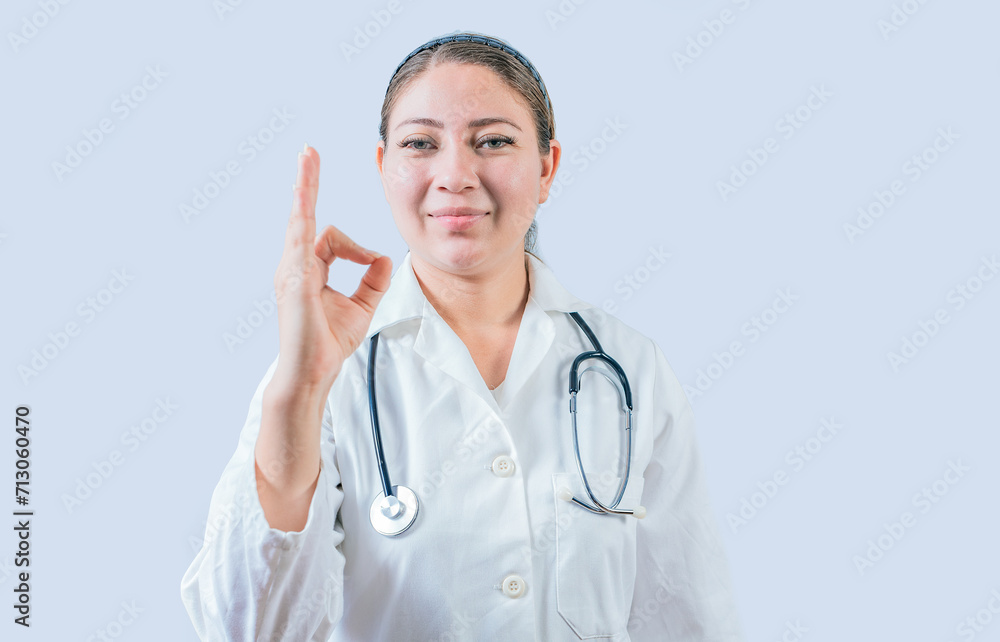 Beautiful female doctor gesturing approval isolated. Smiling female doctor approving and recommending isolated Beautiful female doctor gesturing approval isolated. Smiling female doctor approving and recommending isolated