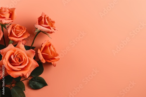 Orange rose flowers with green leaves on orange background, Valentine's day, mother's day, wedding and love concept