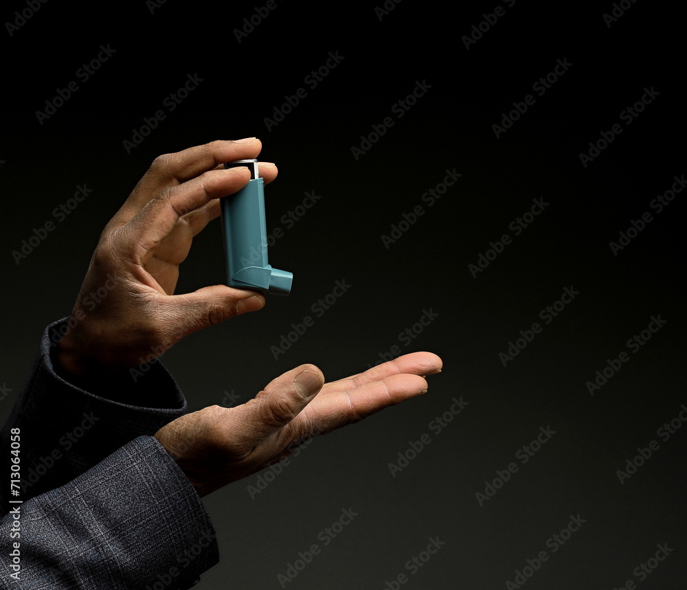 man with respiratory inhaler  puff on grey background with people stock image stock photo    - obrazy, fototapety, plakaty 