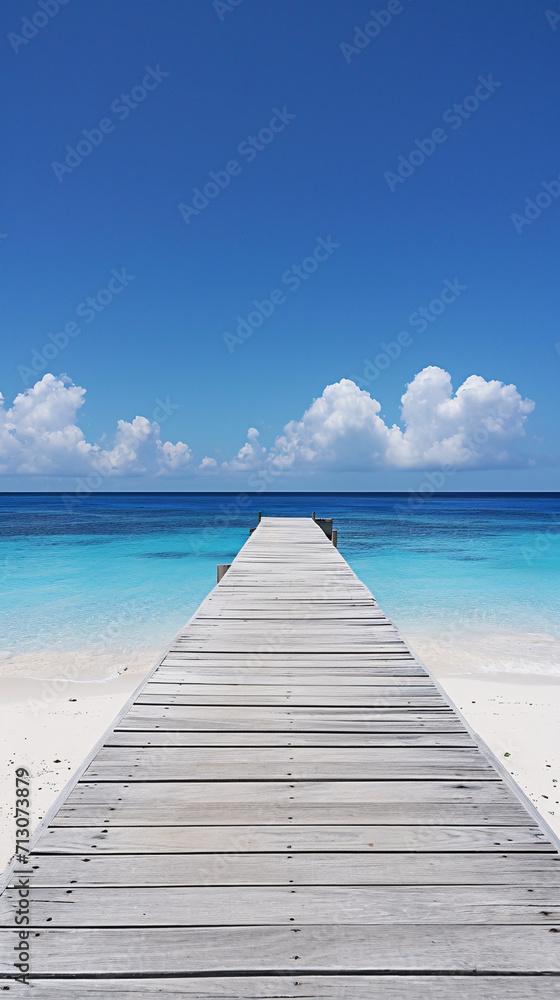 A beautiful wooden walkway or pier leading into a clear blue ocean on a sunny day, perfect summer vacation, travel inspiration