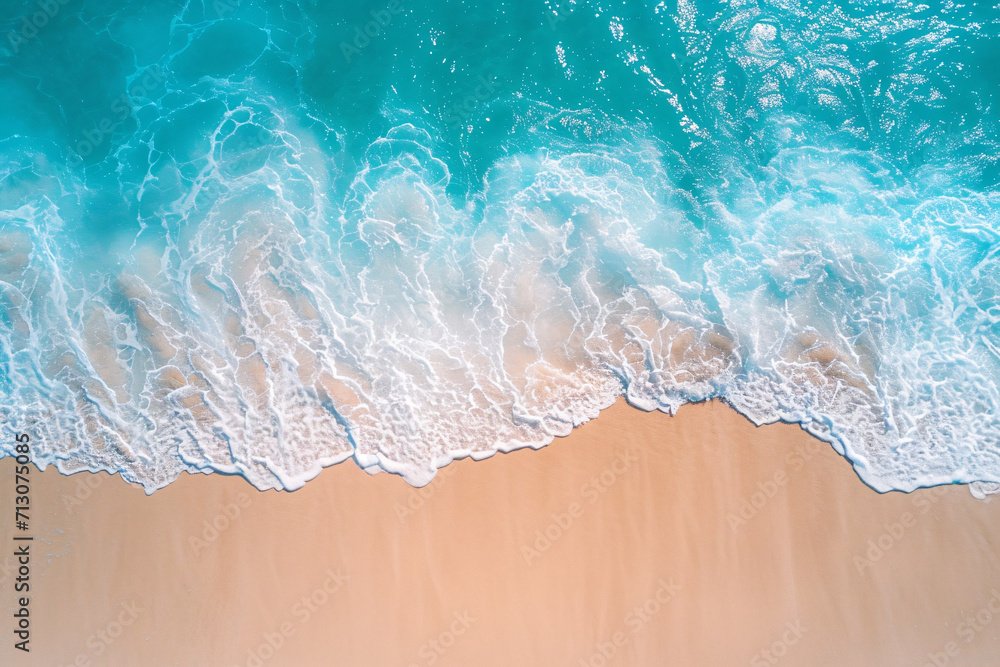 Beautiful blue waves crashing on an empty beach, aerial view, summer vacation background Beautiful blue waves crashing on an empty beach, aerial view, summer vacation background