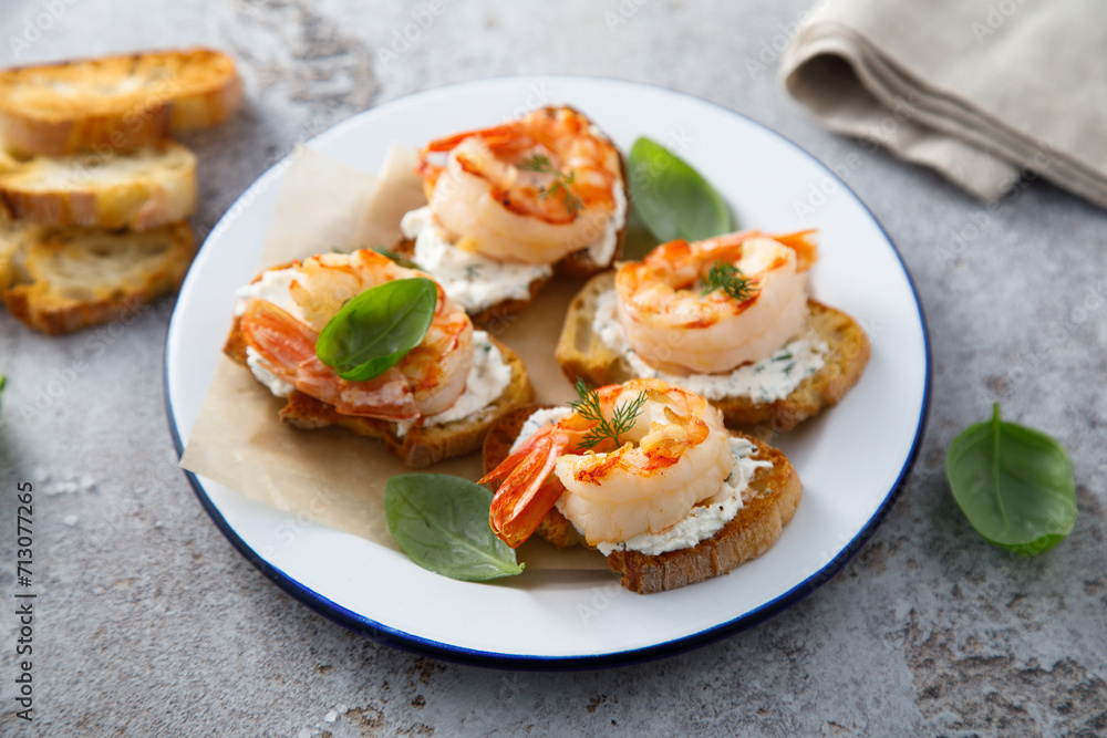 Shrimp crostini with cream cheese and herbs