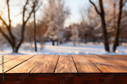 Wooden table snowy trees winter nature bokeh background, empty wood desk product display mockup snow landscape blurry abstract backdrop ads showcase Christmas time presentation. Mock up, copy space. © Synthetica