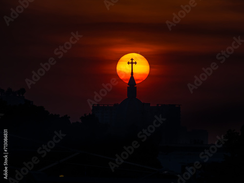 Christ church silhouette with sunset in background