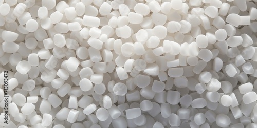 White PVC granulate background, recycled plastic granules, biodegradable plastic. Granules of eco-friendly plastic raw material at the factory photo